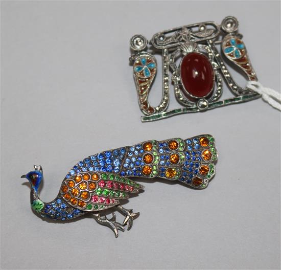 An early 20th century continental 935 standard silver, enamel marcasite and cabochon set brooch and a paste set silver peacock